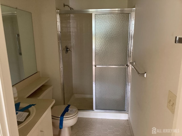 191 Wycoff Way W, East Brunswick, NJ 08816 - full bathroom featuring tile patterned floors, toilet, a shower stall, and vanity