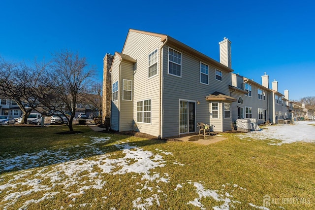 253 Nebula Rd, Piscataway, NJ 08854 - snow covered rear of property featuring a chimney and a lawn