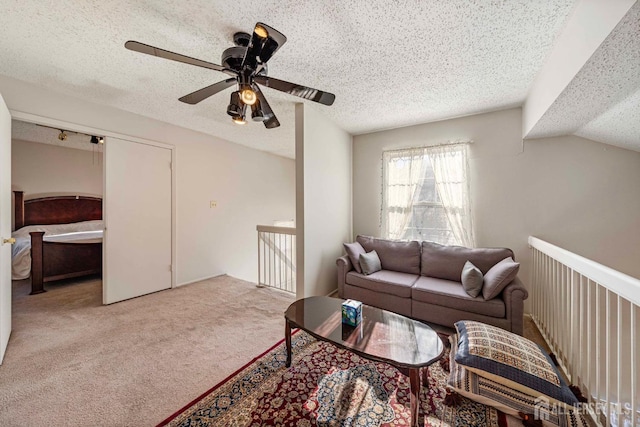 253 Nebula Rd, Piscataway, NJ 08854 - carpeted living area featuring a textured ceiling and a ceiling fan