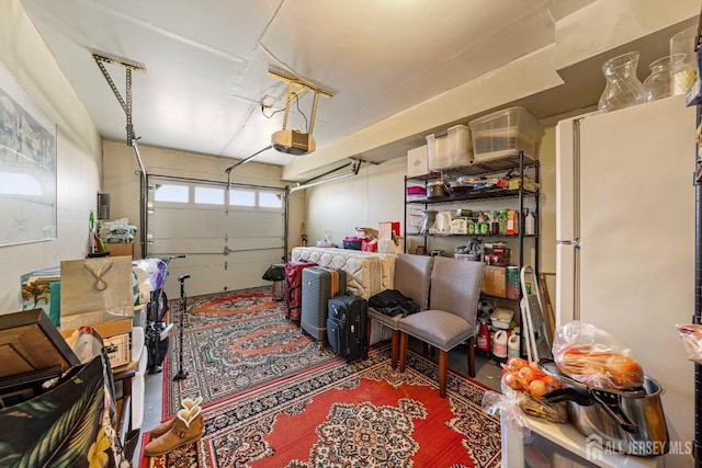 253 Nebula Rd, Piscataway, NJ 08854 - garage with freestanding refrigerator and a garage door opener