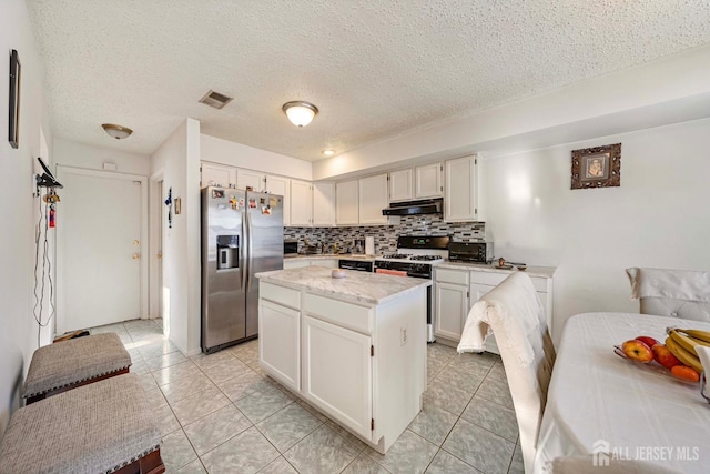 253 Nebula Rd, Piscataway, NJ 08854 - kitchen featuring stainless steel fridge, under cabinet range hood, a kitchen island, decorative backsplash, and light tile patterned floors