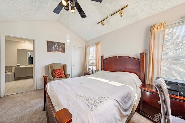 253 Nebula Rd, Piscataway, NJ 08854 - bedroom with vaulted ceiling, light colored carpet, a textured ceiling, ensuite bath, and a ceiling fan