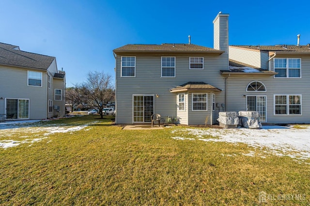 253 Nebula Rd, Piscataway, NJ 08854 - rear view of house featuring a chimney and a lawn