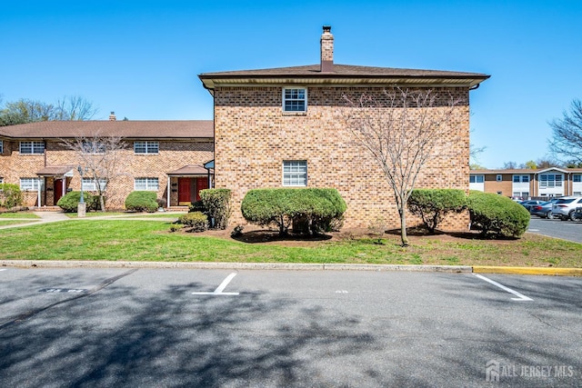 view of property with uncovered parking