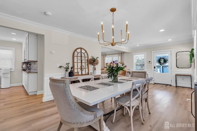 1307 Camp Ave, Ocean, NJ 07712 - dining room featuring a chandelier, crown molding, light wood-style flooring, a wainscoted wall, and recessed lighting