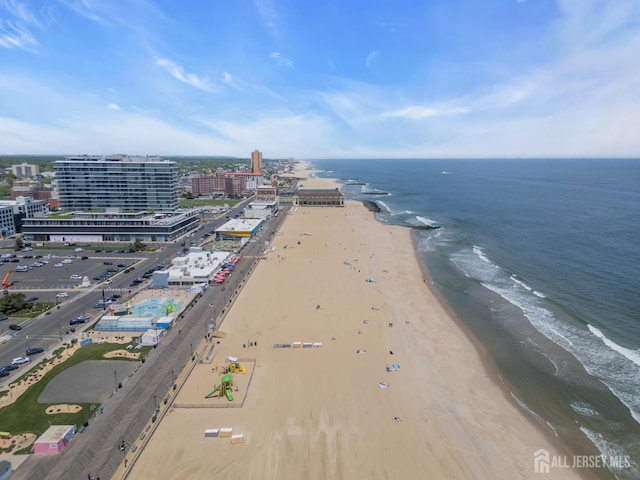 drone / aerial view of waterfront with a beach