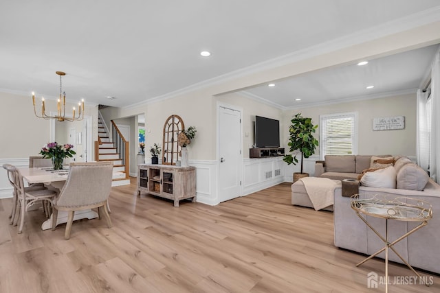 1307 Camp Ave, Ocean, NJ 07712 - living room with stairway, light wood-style floors, crown molding, a chandelier, and a wainscoted wall