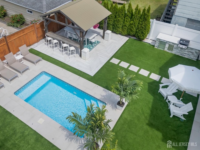1307 Camp Ave, Ocean, NJ 07712 - view of swimming pool with a gazebo, exterior kitchen, an outdoor bar, and a patio area