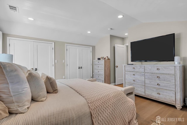 1307 Camp Ave, Ocean, NJ 07712 - bedroom featuring lofted ceiling, two closets, light wood-style flooring, and recessed lighting