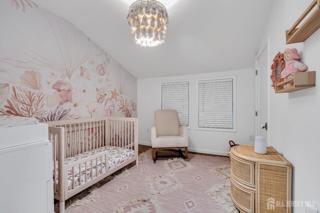 1307 Camp Ave, Ocean, NJ 07712 - bedroom featuring a nursery area, a chandelier, baseboards, and vaulted ceiling
