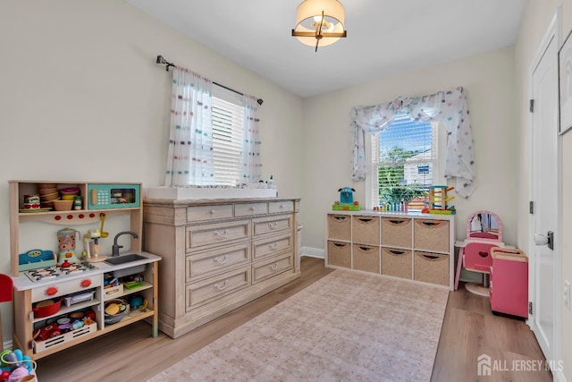 1307 Camp Ave, Ocean, NJ 07712 - recreation room featuring plenty of natural light, light wood-type flooring, and baseboards