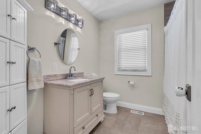 1307 Camp Ave, Ocean, NJ 07712 - full bathroom with baseboards, tile patterned flooring, toilet, and vanity