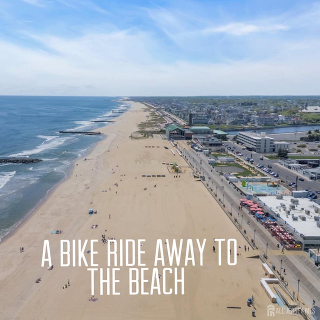 bird's eye view of waterfront with a beach