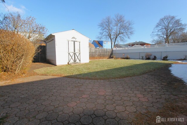 exterior space with a shed