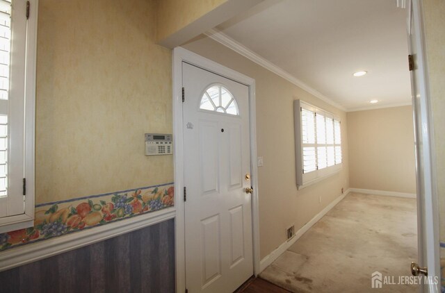 entryway with crown molding