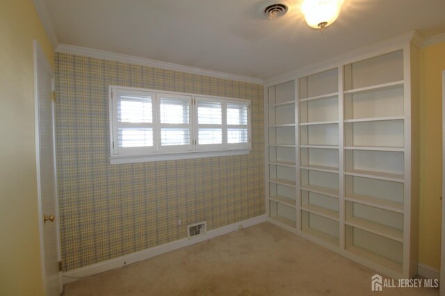 carpeted empty room with crown molding