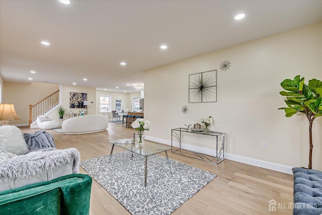 24 Savoy St, Colonia, NJ 07067 - living area with stairs, wood finished floors, baseboards, and recessed lighting