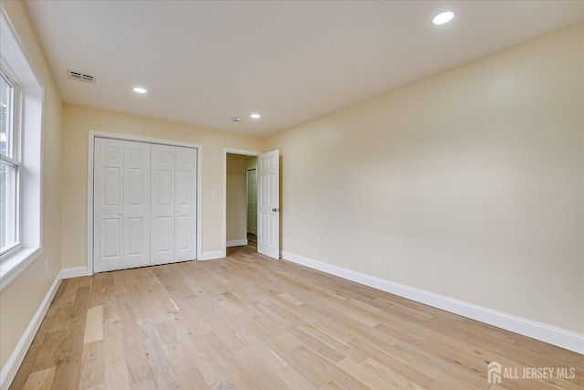 24 Savoy St, Colonia, NJ 07067 - unfurnished bedroom with light wood finished floors, baseboards, a closet, and recessed lighting