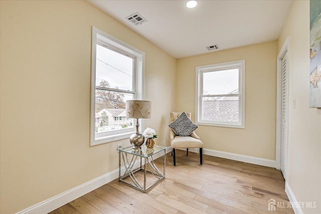 24 Savoy St, Colonia, NJ 07067 - sitting room with plenty of natural light, light wood finished floors, baseboards, and recessed lighting