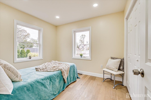 24 Savoy St, Colonia, NJ 07067 - bedroom with a closet, multiple windows, light wood-style floors, baseboards, and recessed lighting