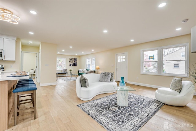 24 Savoy St, Colonia, NJ 07067 - living area featuring light wood-type flooring, baseboards, and recessed lighting