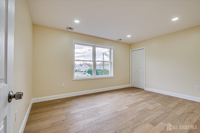 24 Savoy St, Colonia, NJ 07067 - empty room with light wood-style floors, recessed lighting, and baseboards