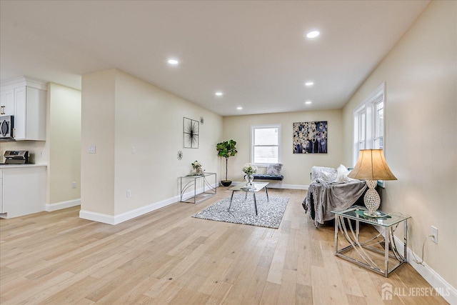 24 Savoy St, Colonia, NJ 07067 - living area featuring light wood-style floors, recessed lighting, and baseboards