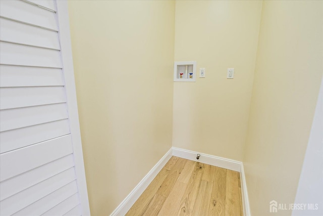 24 Savoy St, Colonia, NJ 07067 - laundry room with hookup for a washing machine, light wood finished floors, and baseboards