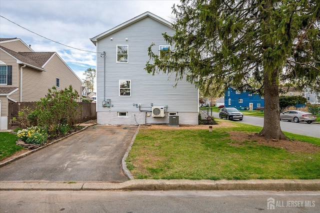24 Savoy St, Colonia, NJ 07067 - view of side of property with cooling unit, a cooling unit, and driveway