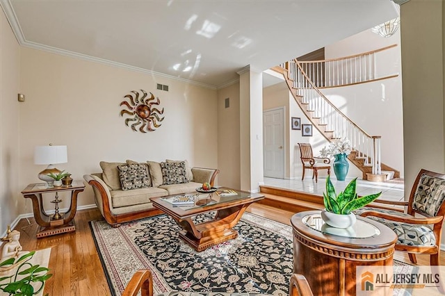 27 Revere Ct, West Windsor, NJ 08550 - living room with wood finished floors, stairway, ornamental molding, and baseboards