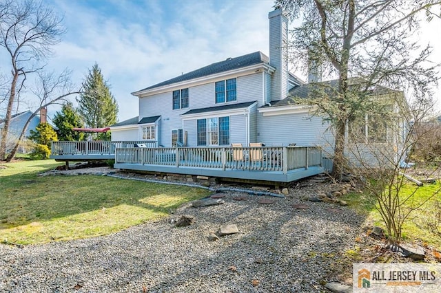 27 Revere Ct, West Windsor, NJ 08550 - rear view of house featuring a deck, a chimney, and a lawn