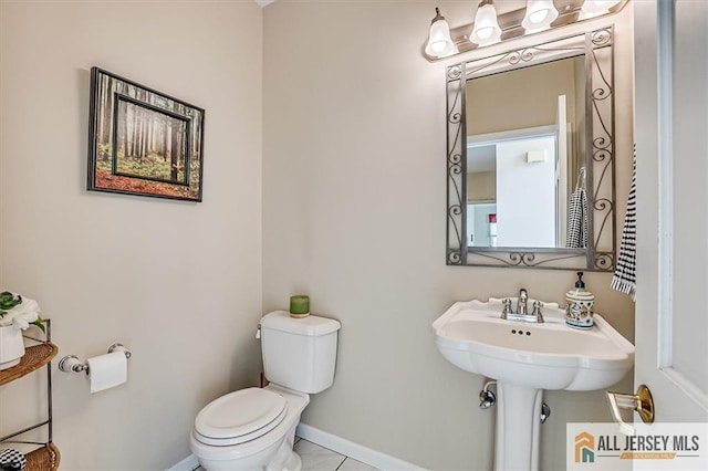 27 Revere Ct, West Windsor, NJ 08550 - bathroom featuring toilet and baseboards