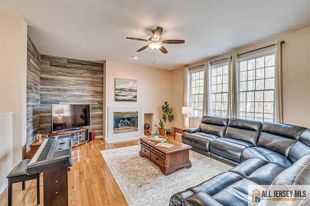 27 Revere Ct, West Windsor, NJ 08550 - living room featuring a ceiling fan, wood finished floors, and a high end fireplace