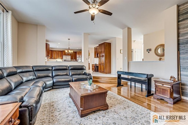 27 Revere Ct, West Windsor, NJ 08550 - living room featuring a chandelier, ceiling fan, light wood-style flooring, and recessed lighting