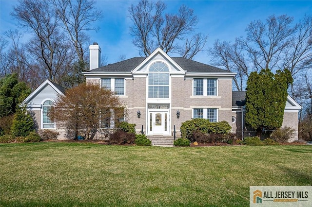 27 Revere Ct, West Windsor, NJ 08550 - view of front of house with a chimney and a front lawn
