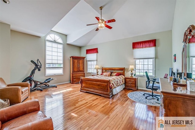 27 Revere Ct, West Windsor, NJ 08550 - bedroom with multiple windows, baseboards, hardwood / wood-style flooring, and high vaulted ceiling
