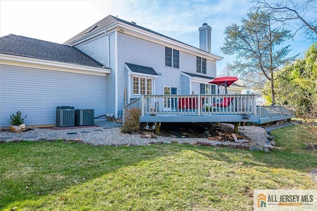 27 Revere Ct, West Windsor, NJ 08550 - back of house with a chimney, a deck, and a yard