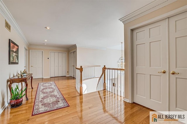27 Revere Ct, West Windsor, NJ 08550 - corridor featuring an upstairs landing, crown molding, wood finished floors, recessed lighting, and baseboards