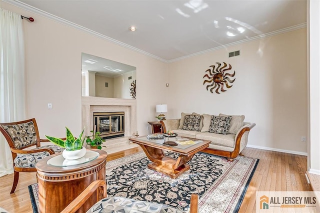 27 Revere Ct, West Windsor, NJ 08550 - living area with wood-type flooring, baseboards, crown molding, and a premium fireplace