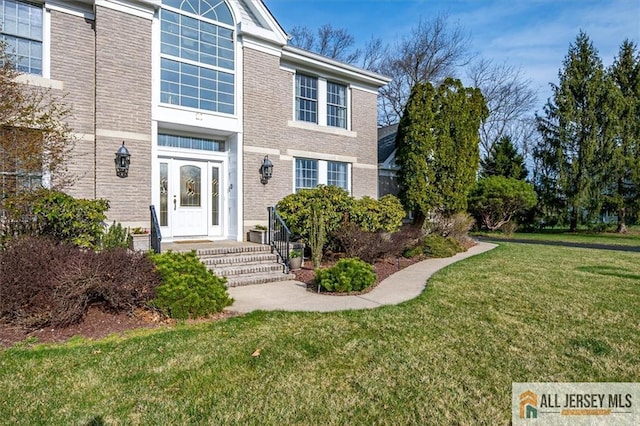 27 Revere Ct, West Windsor, NJ 08550 - view of exterior entry featuring a lawn