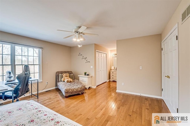 27 Revere Ct, West Windsor, NJ 08550 - bedroom with baseboards, light wood-type flooring, and a ceiling fan