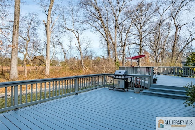 27 Revere Ct, West Windsor, NJ 08550 - wooden deck with a grill