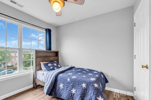3 Kuczynski Dr, Sayreville, NJ 08859 - bedroom with multiple windows, wood finished floors, and ceiling fan
