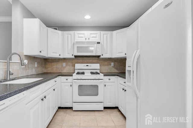 3 Kuczynski Dr, Sayreville, NJ 08859 - kitchen with white appliances, dark countertops, white cabinets, and recessed lighting