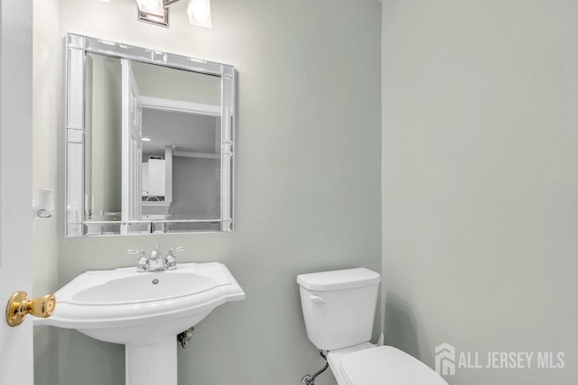 3 Kuczynski Dr, Sayreville, NJ 08859 - half bathroom featuring toilet and a sink