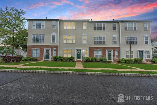 3 Kuczynski Dr, Sayreville, NJ 08859 - colonial inspired home featuring brick siding and a yard