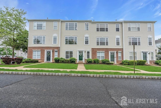 3 Kuczynski Dr, Sayreville, NJ 08859 - view of front facade featuring brick siding and a front lawn
