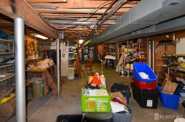 unfinished below grade area featuring a workshop area
