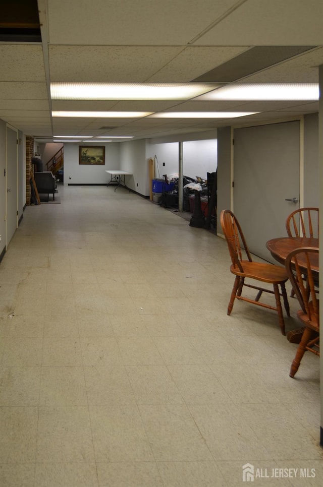 finished basement with tile patterned floors