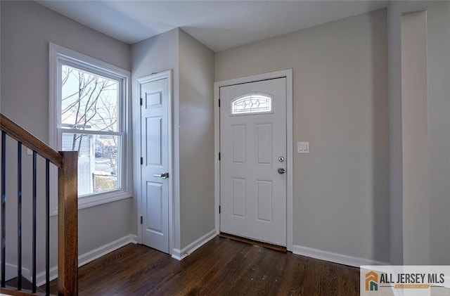 foyer entrance featuring dark hardwood / wood-style flooring